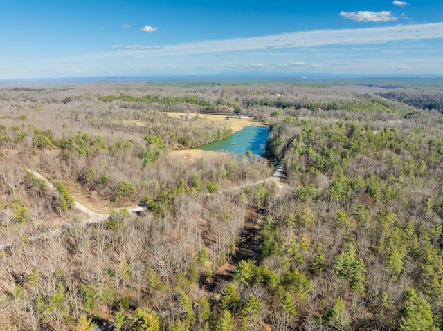 aerial view with a forest view and a water view