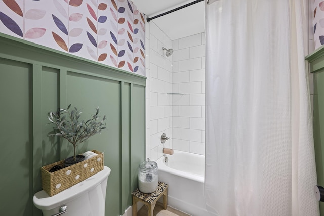 bathroom featuring toilet and shower / bathtub combination with curtain