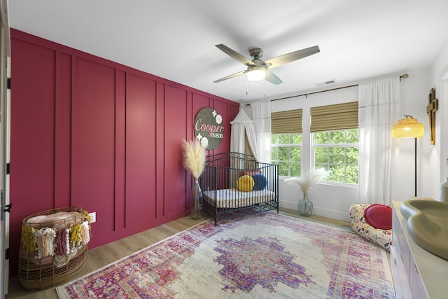 bedroom featuring light wood-type flooring and ceiling fan