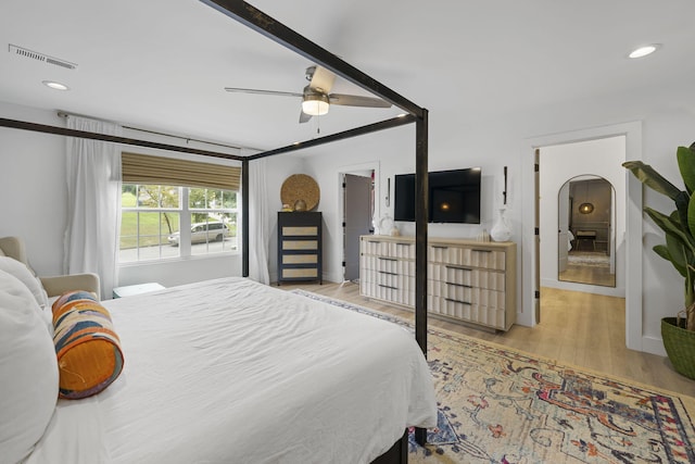 bedroom featuring light hardwood / wood-style floors and ceiling fan