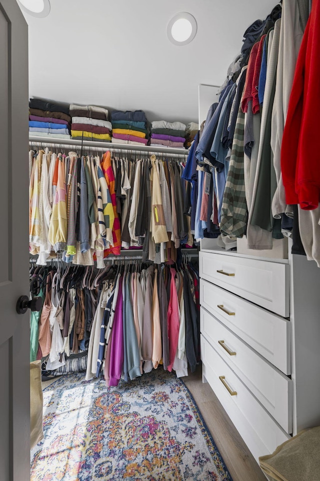 spacious closet featuring hardwood / wood-style flooring