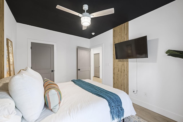 bedroom with light wood-type flooring and ceiling fan