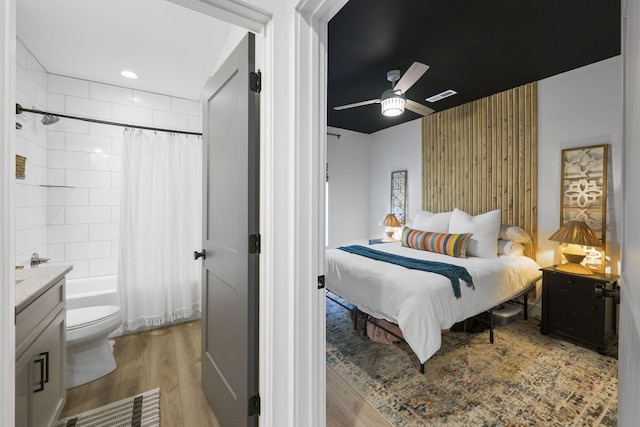 bedroom featuring ceiling fan and light hardwood / wood-style floors