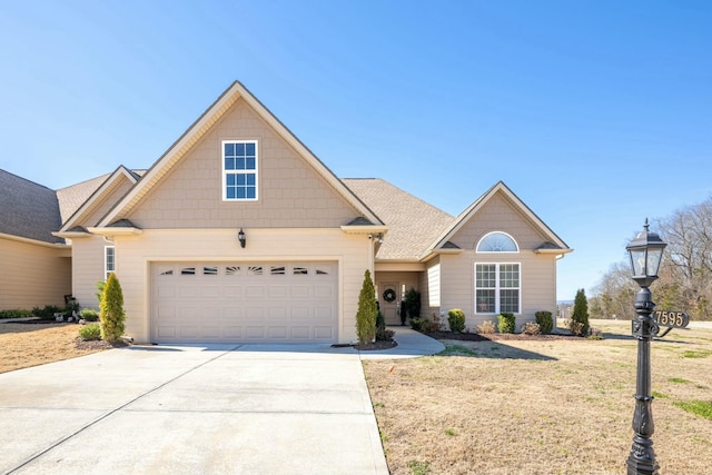 view of front of property with a front lawn and a garage