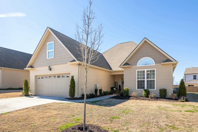 view of front of home with a front lawn and a garage