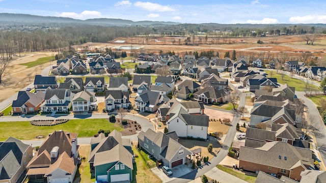 drone / aerial view with a mountain view and a residential view