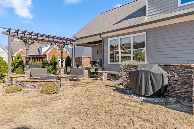 view of patio featuring an outdoor hangout area, ceiling fan, grilling area, and a pergola