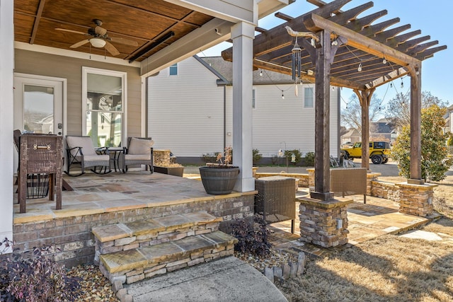 view of patio / terrace with ceiling fan and a pergola