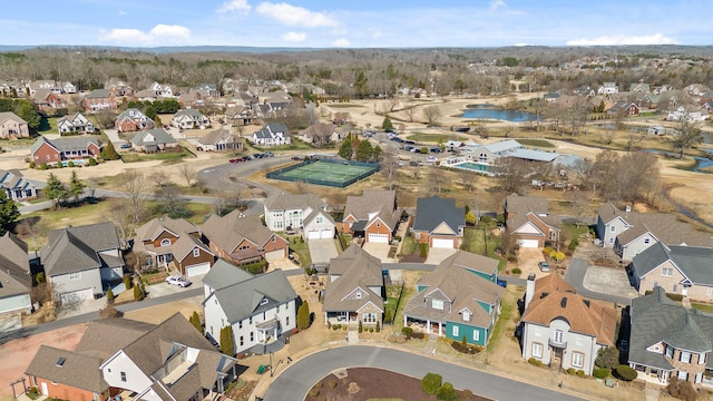 bird's eye view with a water view and a residential view