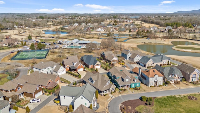 bird's eye view featuring a water view and a residential view