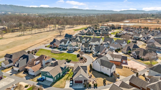 birds eye view of property with a mountain view and a residential view