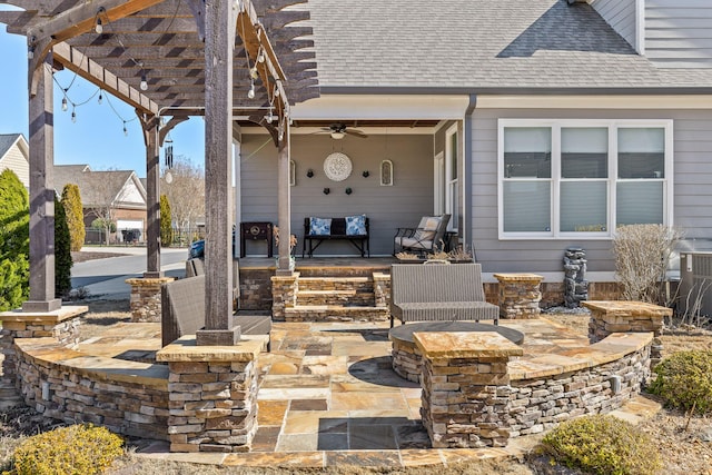 view of patio featuring a ceiling fan and a pergola