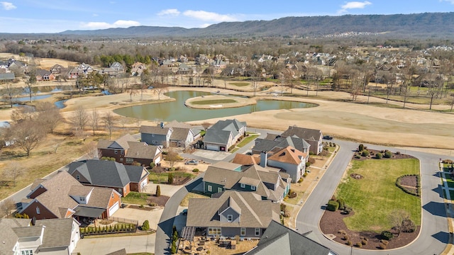 birds eye view of property with a residential view and a water and mountain view