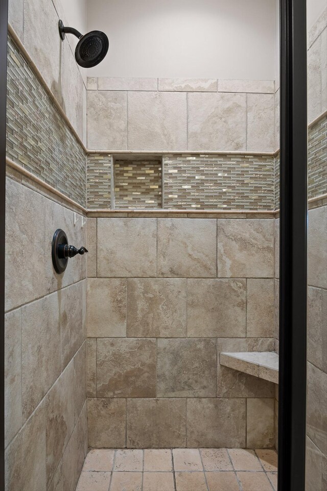 full bathroom with tiled shower