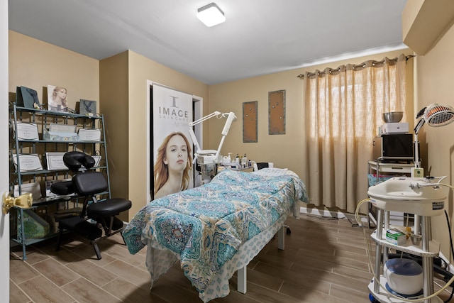 bedroom with wood tiled floor