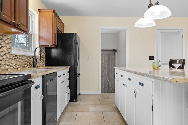 kitchen with backsplash, a sink, brown cabinetry, light tile patterned floors, and black appliances