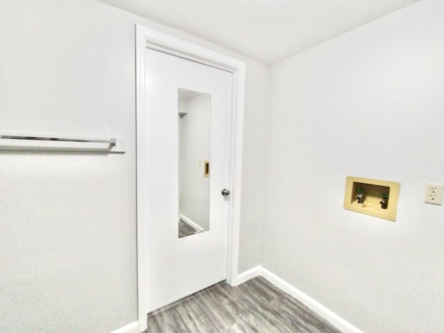 washroom featuring washer hookup and wood-type flooring
