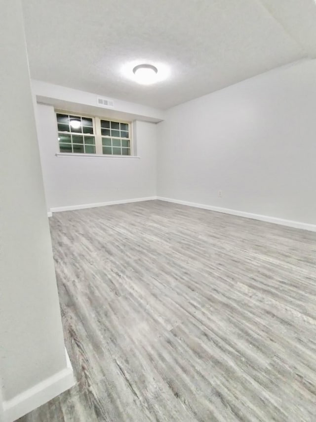 spare room featuring hardwood / wood-style flooring
