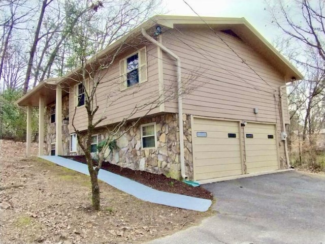 view of side of property with a garage