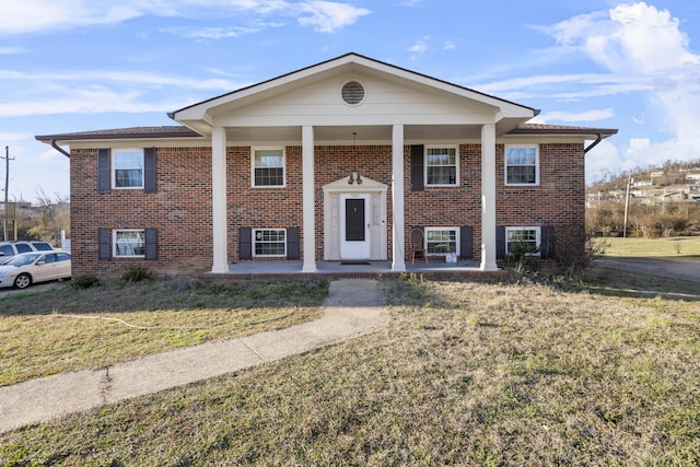 split foyer home with a front lawn