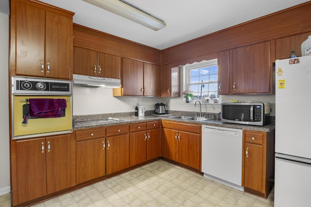 kitchen with sink and white appliances