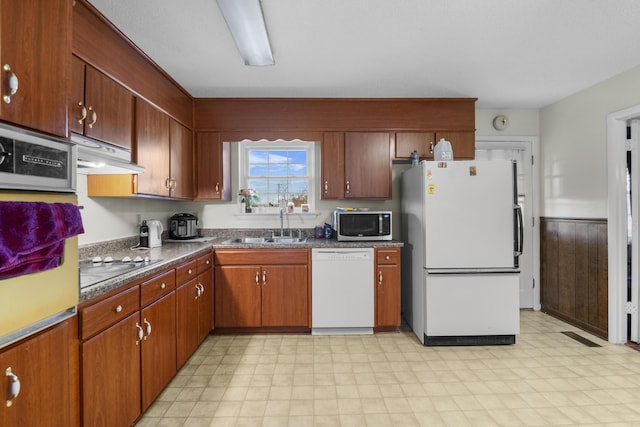 kitchen with white appliances and sink