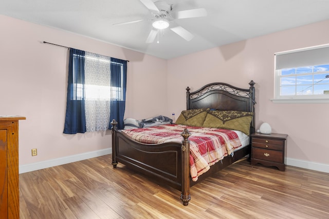 bedroom featuring hardwood / wood-style floors and ceiling fan