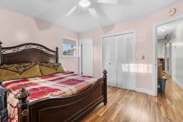 bedroom featuring ceiling fan, light hardwood / wood-style flooring, and a closet