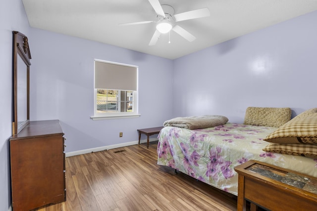 bedroom featuring ceiling fan and wood-type flooring