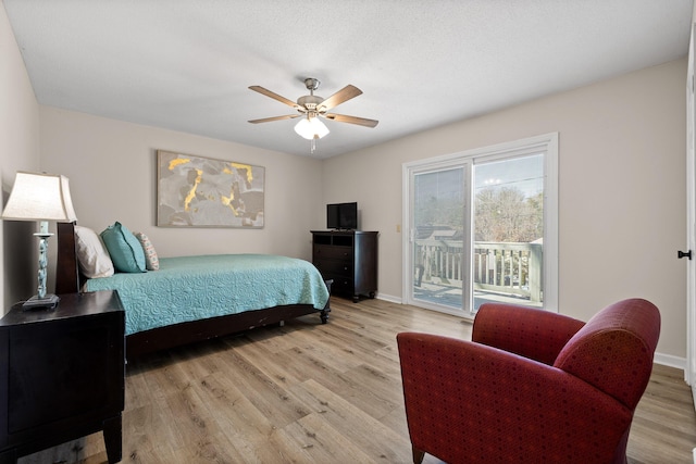 bedroom featuring light wood finished floors, access to outside, baseboards, and a ceiling fan