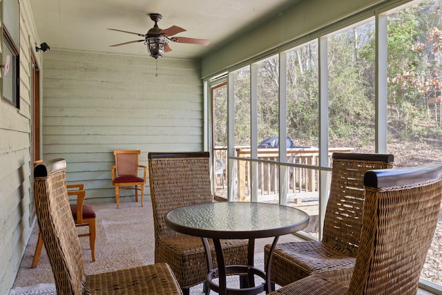 sunroom / solarium with ceiling fan