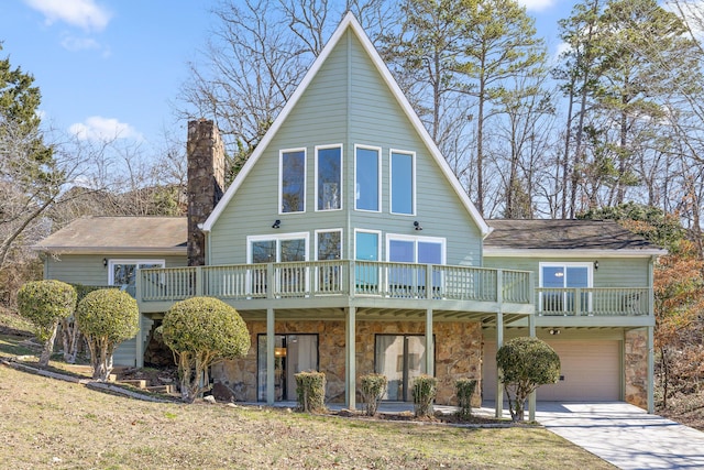 view of front of property with a garage, stone siding, a chimney, and concrete driveway