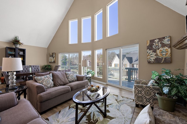 living area featuring lofted ceiling and wood finished floors