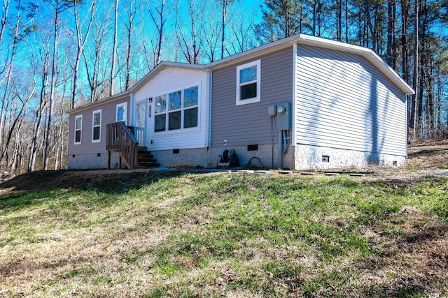 exterior space with crawl space and a front yard