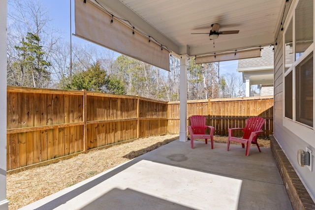 view of patio featuring a ceiling fan and a fenced backyard