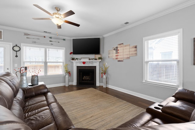 living room featuring dark wood finished floors, visible vents, crown molding, and baseboards