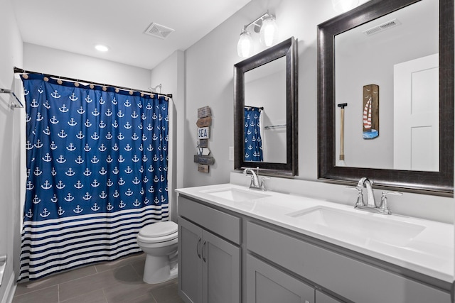 full bath featuring toilet, visible vents, and a sink