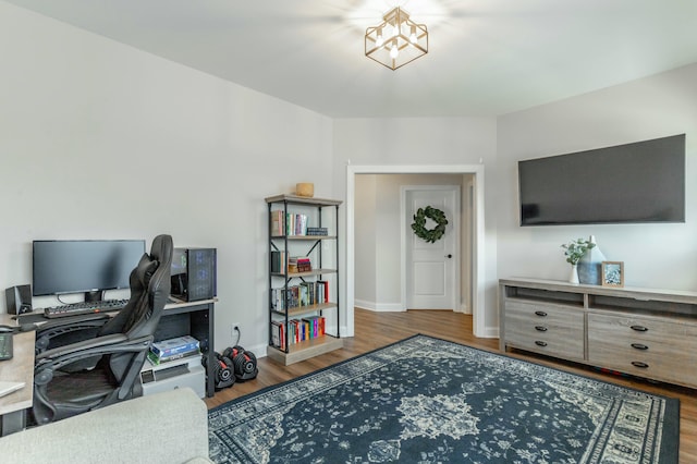 home office with wood finished floors and baseboards