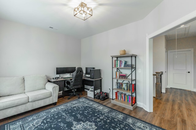 office area featuring baseboards, attic access, visible vents, and wood finished floors