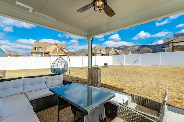 view of patio with a ceiling fan, a fenced backyard, and an outdoor hangout area