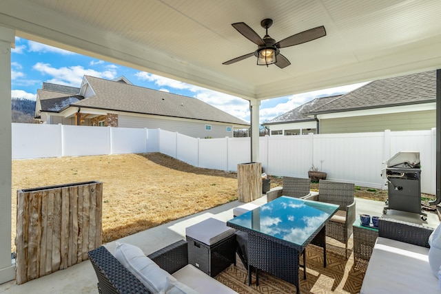 view of patio / terrace featuring area for grilling, outdoor dining space, ceiling fan, a fenced backyard, and an outdoor living space