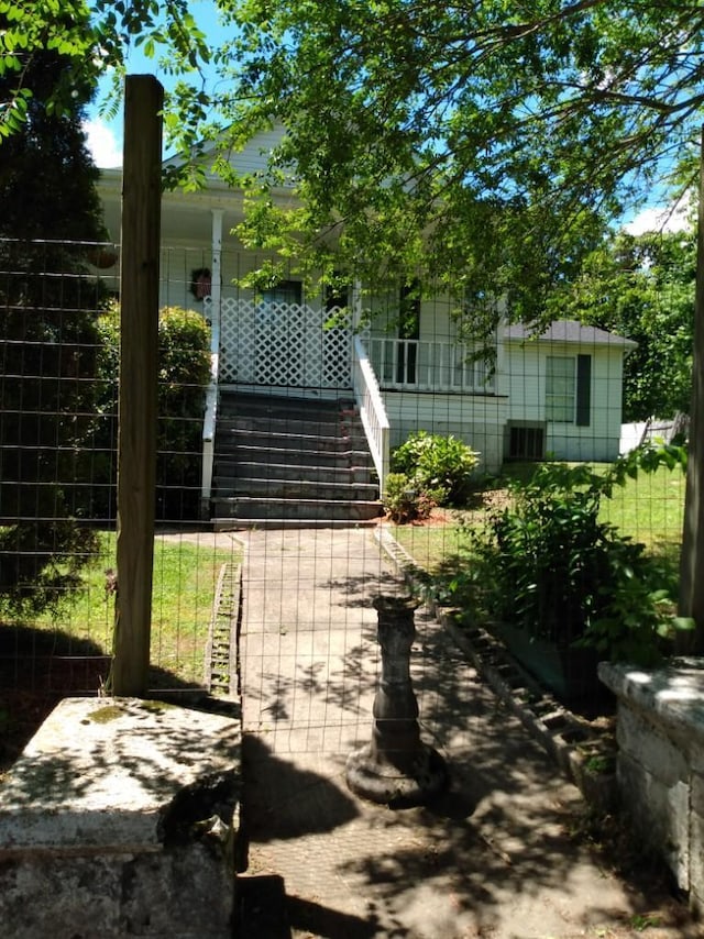 exterior space featuring fence and stairway