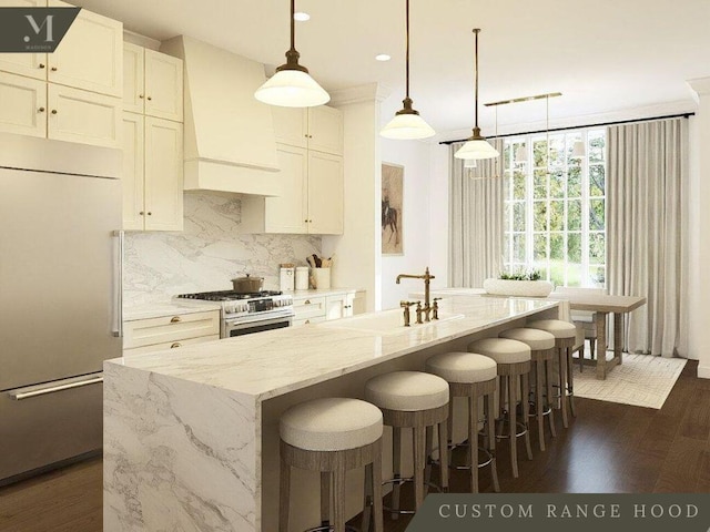 kitchen featuring dark wood-style floors, custom range hood, decorative backsplash, appliances with stainless steel finishes, and a sink