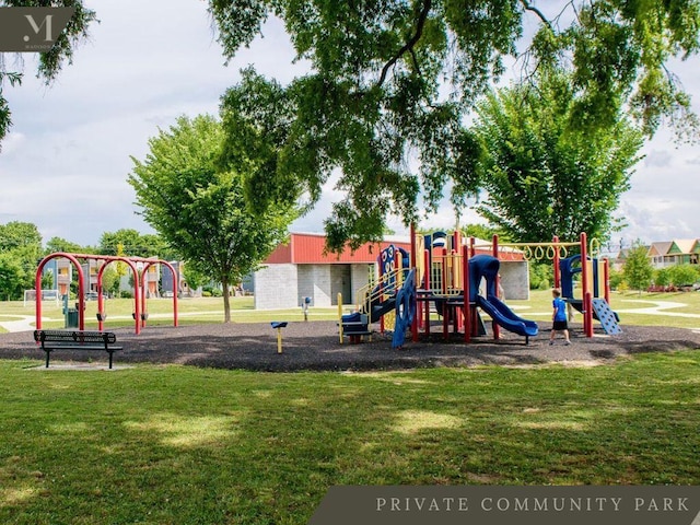 communal playground featuring a lawn