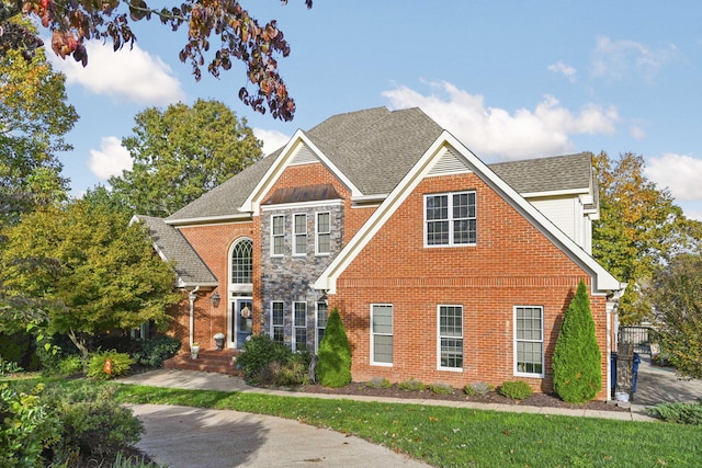 traditional-style home with brick siding and roof with shingles