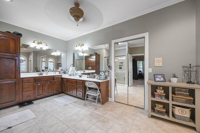 bathroom with tile patterned flooring, ceiling fan, crown molding, and vanity