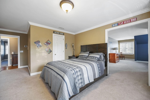 carpeted bedroom with visible vents, crown molding, and baseboards