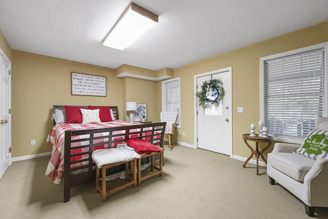 carpeted bedroom with baseboards