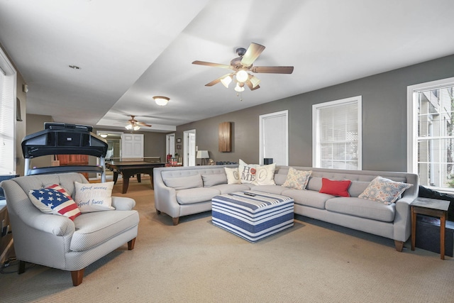 living room with carpet floors and a ceiling fan