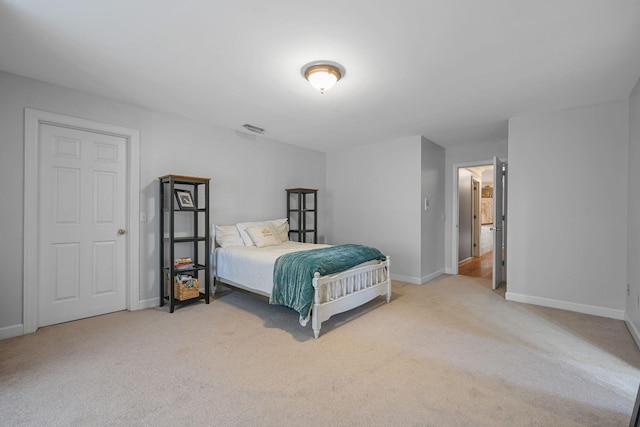 bedroom featuring carpet flooring, visible vents, and baseboards